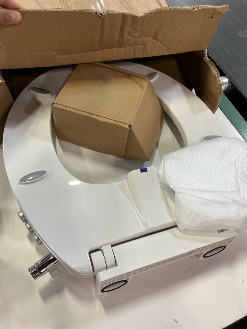 Condition photo showing As Is for bidet toilet seat, soft close round toilet seat, button control feminine/posterior wash switch, knob control water pressure,white bidet seat attachment with brass inlet