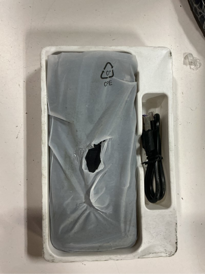 Condition photo showing As Is for pocket juice endurance ac, 20,000 mah portable power bank charger with built-in wall plug