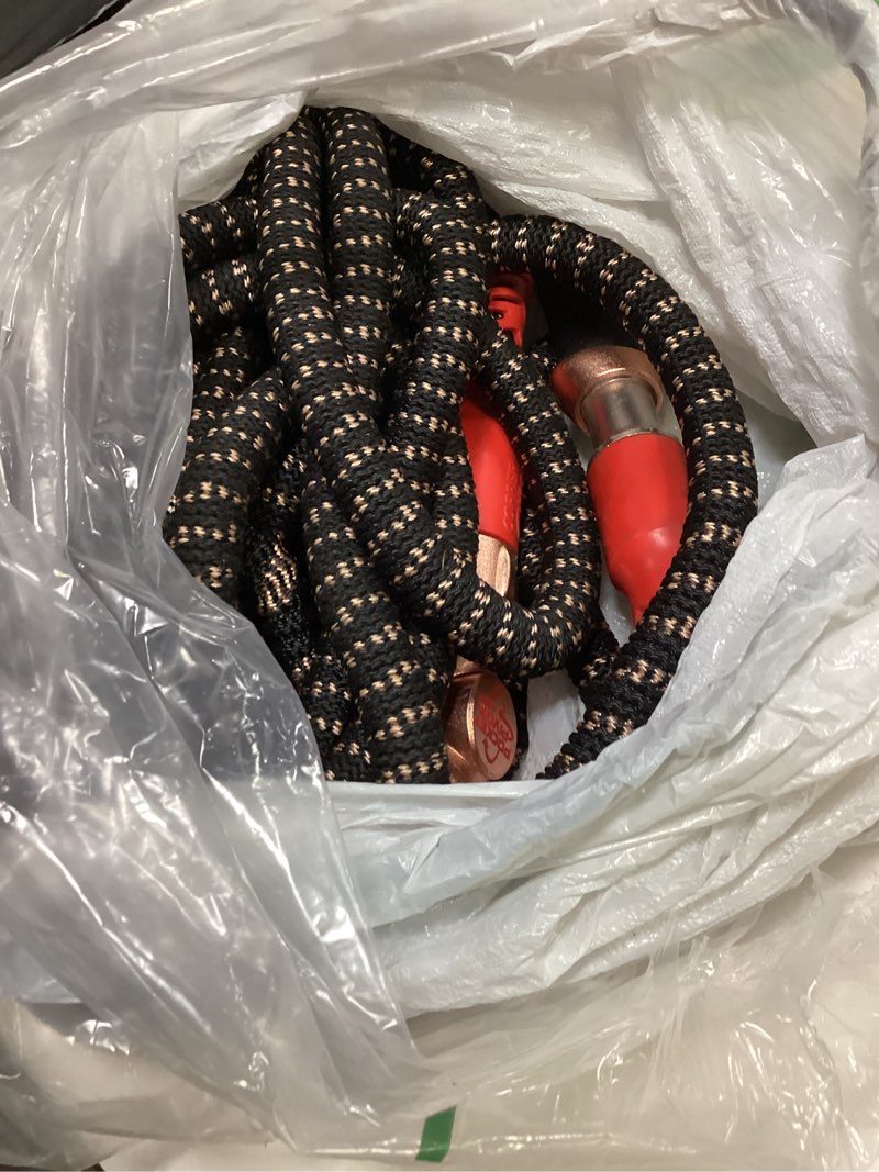 Condition photo showing As Is for pocket hose 100 ft copper head expandable garden hose with pocket pivot, no tangles, as seen on tv, 360° swivel, tri-tex tubing, force field jacket, lead-free, no-kink, anti-burst w/apt regular 100 ft