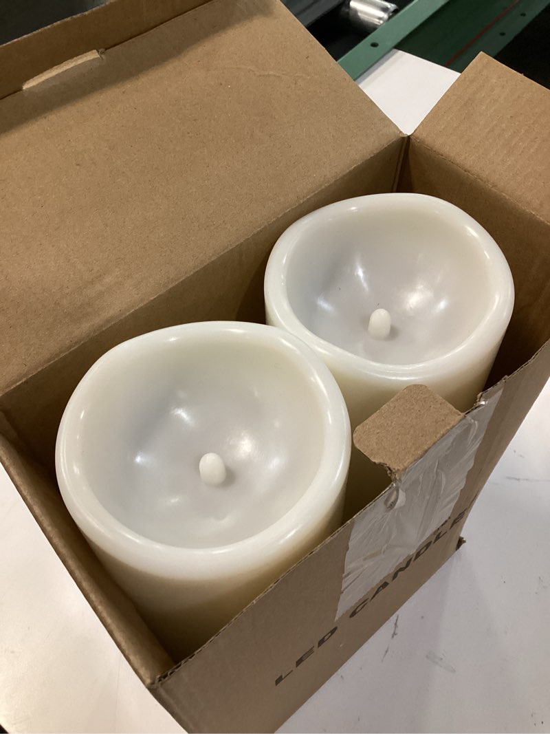 Condition photo showing As Is for eldnacele 4"×10" large waterproof outdoor flameless candles remote and timer, battery operated white plastic led flickering pillar candles 2 pack for dinner wedding porch garden lanterns home decor 2-2 pack cream remote 10