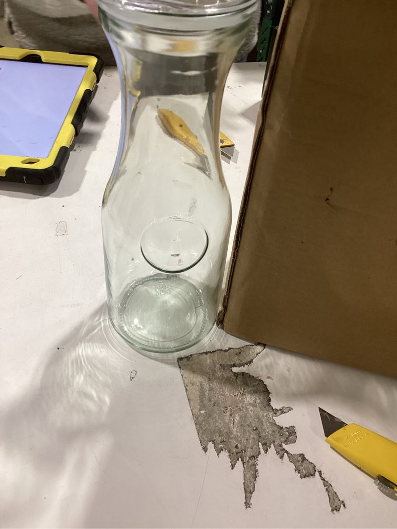 Condition photo showing As Is for NETANY Set of 4 Glass Carafe with Lid, 1 Liter Beverage Serveware Carafe, Clear Glass Pitcher for Mimosa Bar, Brunch, Cold Water, Juice, Milk, Iced Tea, Lemonade