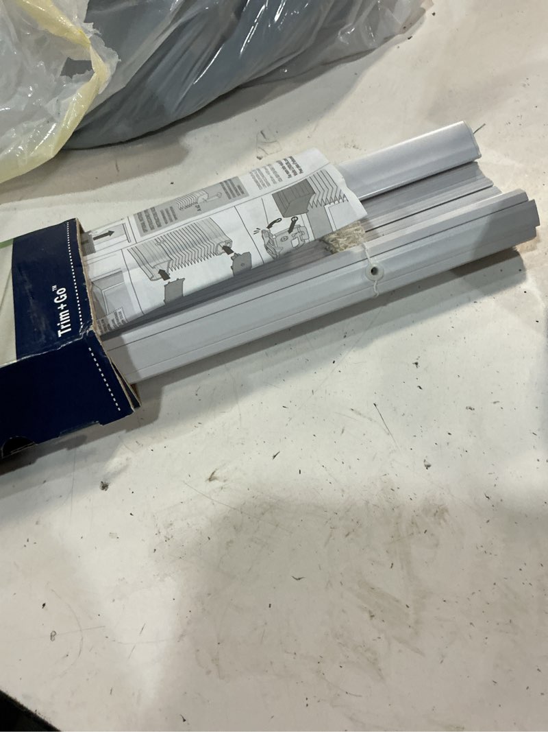 Condition photo showing As Is for levolor trim+go 1-in slat width 29-in x 64-in cordless white vinyl room darkening mini-blinds