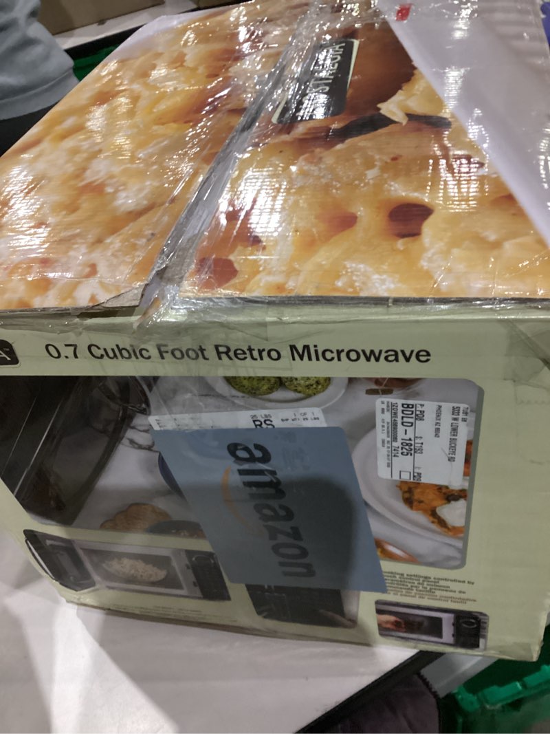 Condition photo showing As Is for Nostalgia Retro Microwave Oven - 0.7 Cu Ft, 700-Watt Countertop Size with Glass Turntable, Child Safety Lock, 8 Auto-Cook Programs, Digital Clock - Black 0.7 Cu. Ft. Black