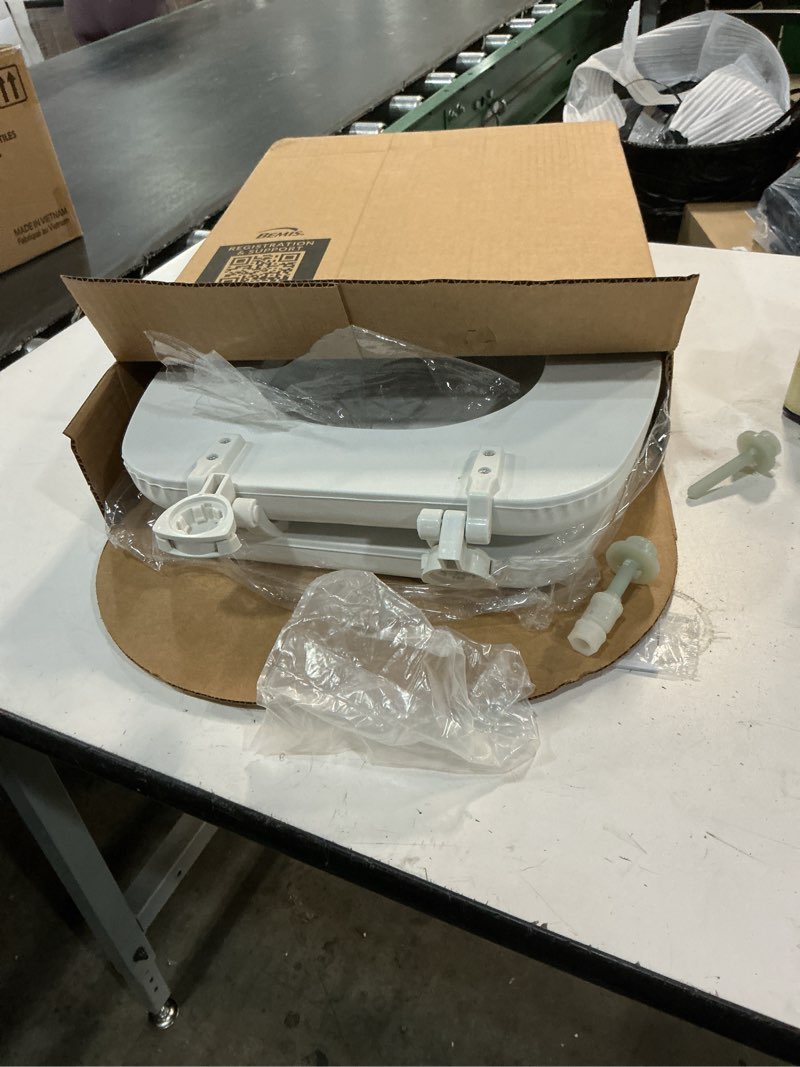 Condition photo showing Good Condition for mayfair padded toilet seat, cushioned soft vinyl over wood core seat, secure hinges, easy clean, made in usa, elongated, white elongated white toilet seat