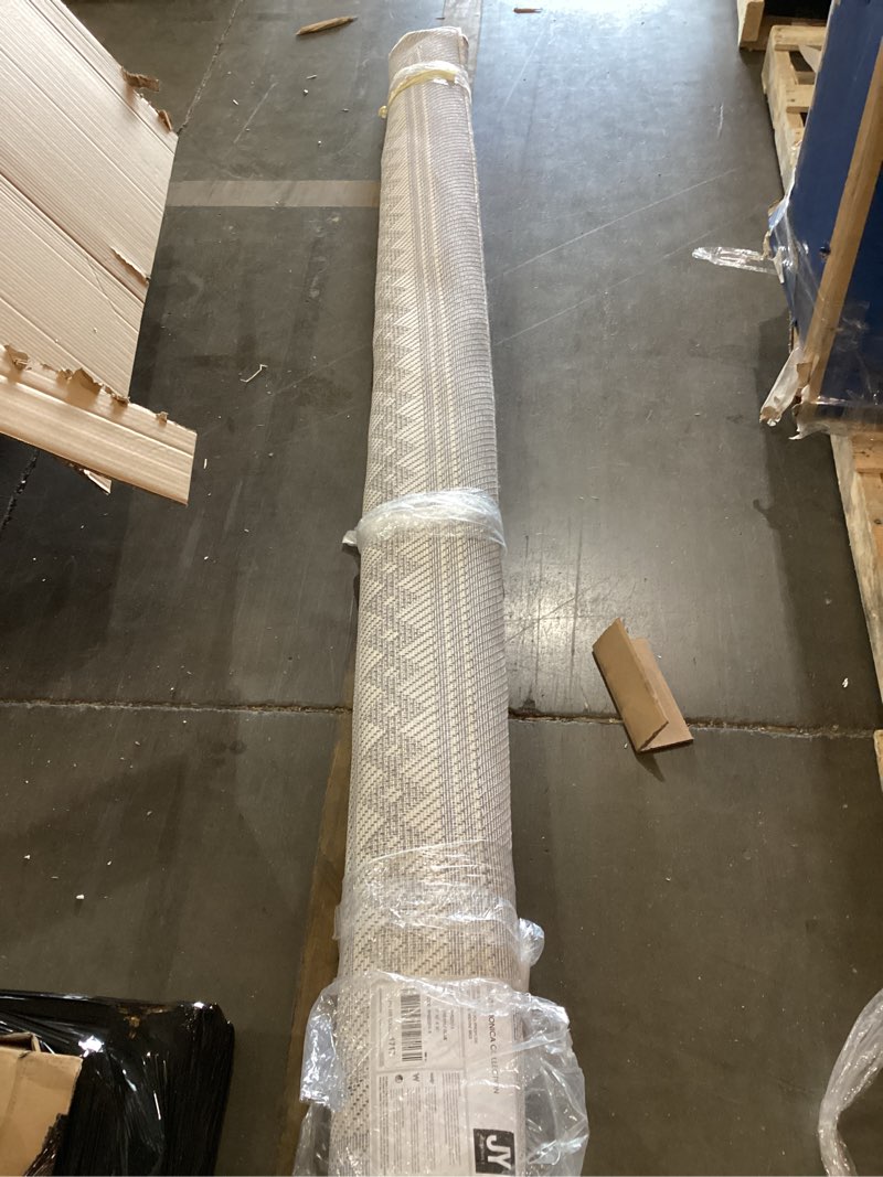 Condition photo showing New/Like New for 7’x10’x10’ area rug
