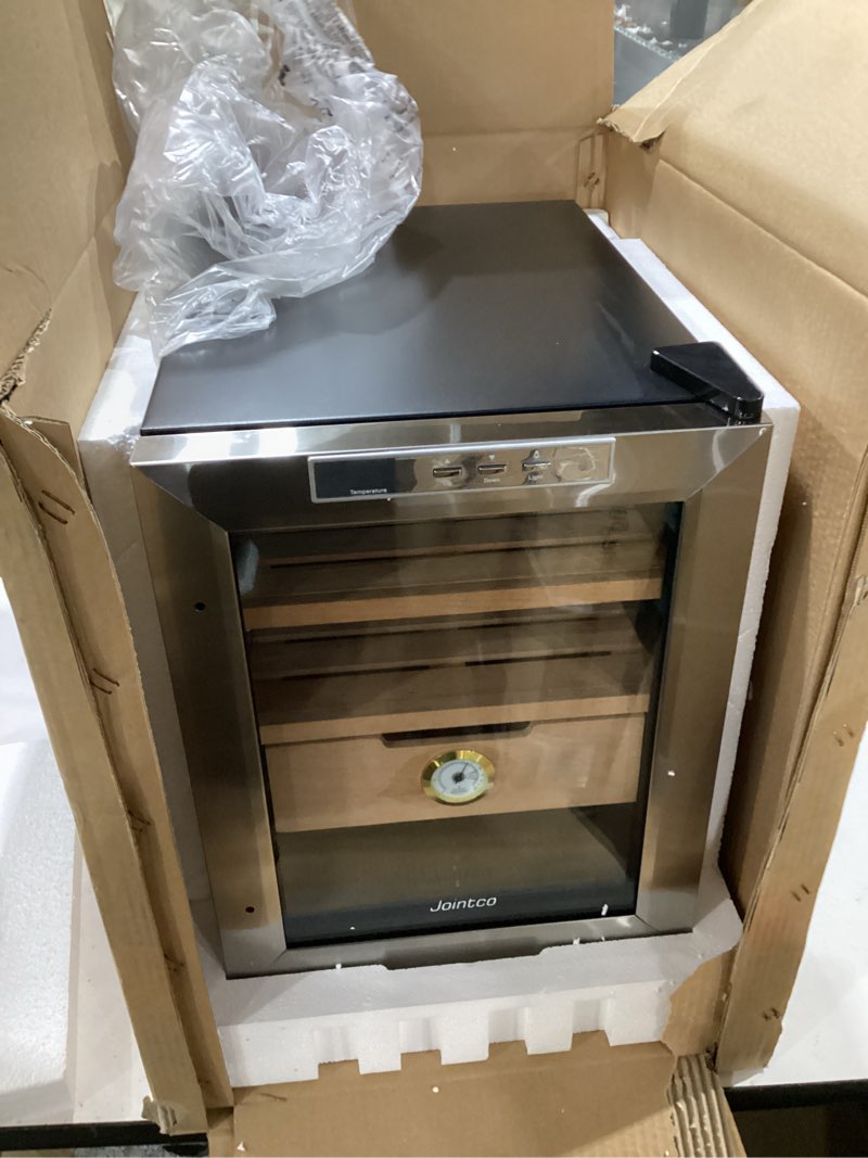 Condition photo showing New/Like New for jointco mini cooler humidor, 1.2 cu. ft, 250 counts capacity, stainless steel glass door with humidity tray and hygrometer