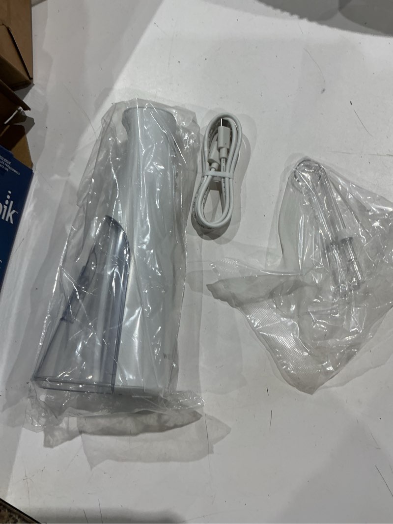 Condition photo showing Good Condition for waterpik cordless pulse 3100 rechargeable portable water flosser for teeth, gums, braces care and travel with 2 flossing tips, waterproof for shower use, ada accepted, wf-20 white, amazon exclusive
