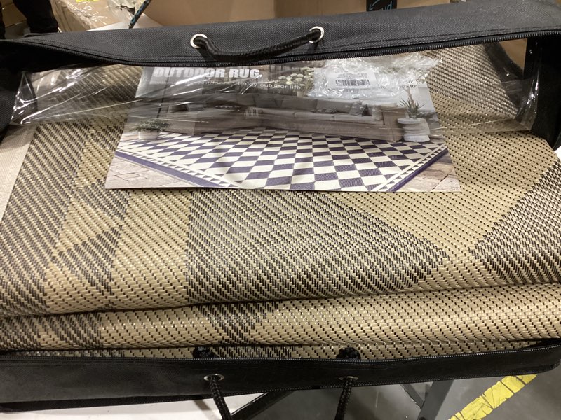 Condition photo showing Good Condition for hugear outdoor rug for patios clearance,waterproof mat,large outside carpet,reversible plastic straw camping rugs,rv,porch,deck,camper,balcony,backyard (9x12,checkered/black&beige)