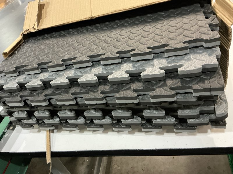 Condition photo showing As Is for xspec 1\" extra thick 48 sq ft reversible eva gym foam floor mat tiles (24\" x 24\"), steel pattern, 12 pcs, black & grey