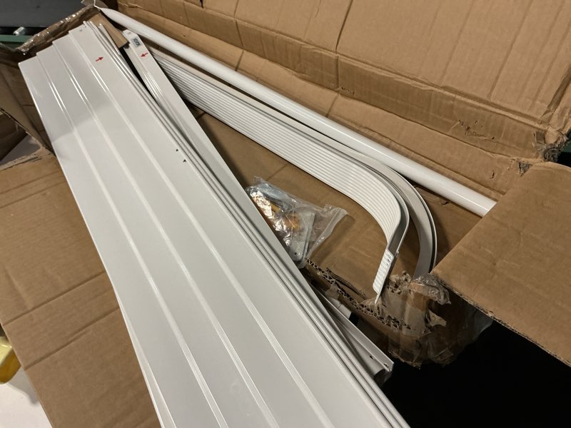 Condition photo showing As Is for kozyard window awning w48'' x d40'', aluminum frame with impact-resistant pvc panels, shade angle set during installation, rain, snow & uv protection door canopy white w48'' x d40''