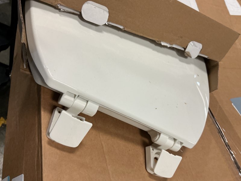 Condition photo showing As Is for ez-flo white plastic toilet seat with lid, round, 65901