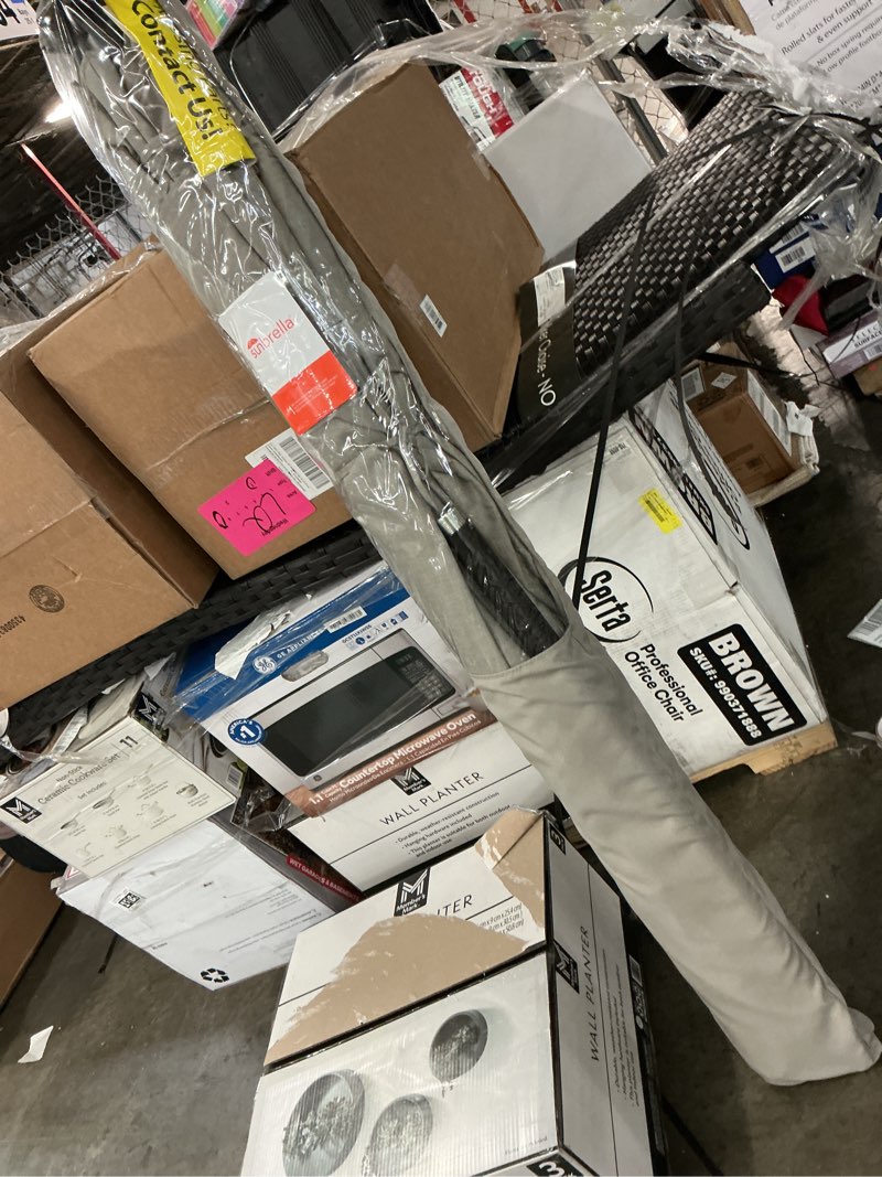 Condition photo showing As Is for sunbrella auto tilt umbrella (incomplte)
