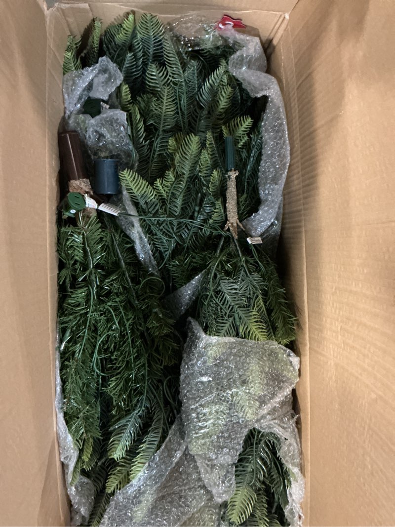 Condition photo showing Good Condition for puleo international 6.5ft pre-lit aspen fir artificial christmas tree with 500 clear lights, 903 realistic dense branch tips, easy setup artificial trees with sturdy metal stand 6.5' aspen fir with 500 clear lights