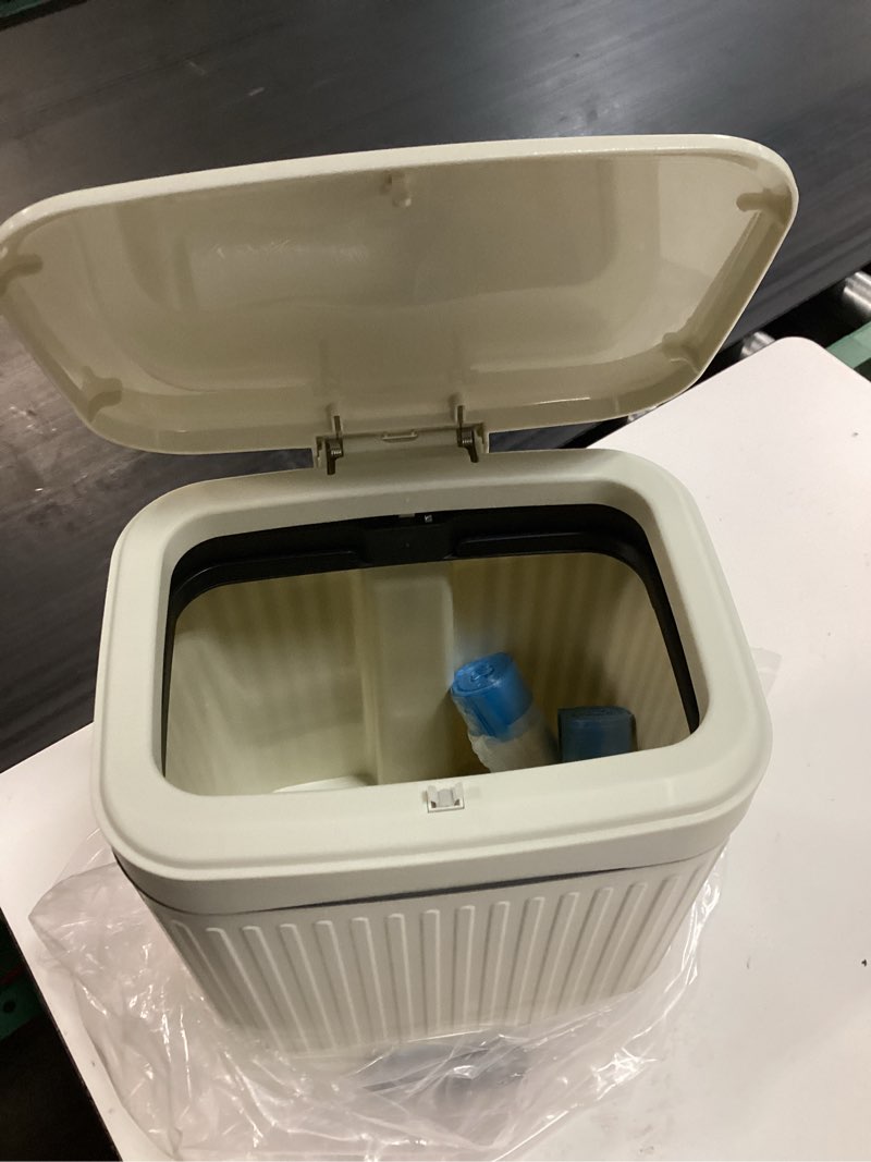Condition photo showing As Is for rejomiik small bathroom trash can with lid 2.1 gallon soft close step slim garbage can waste bin for office, bedroom, kitchen, cream 2.1 gallon cream