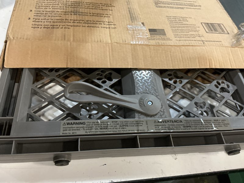 Condition photo showing As Is for mypet paws portable pet gate: 26-40" wide expandable, pressure mounted no tools needed, durable dog gate for doorways, made in usa, 23" tall, fieldstone gray