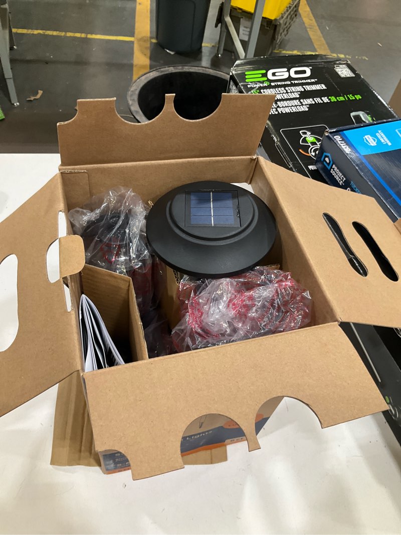 Condition photo showing As Is for harbor breeze 6 -pack 10 -lumens matte black solar led outdoor path light kit ( 3000-k )