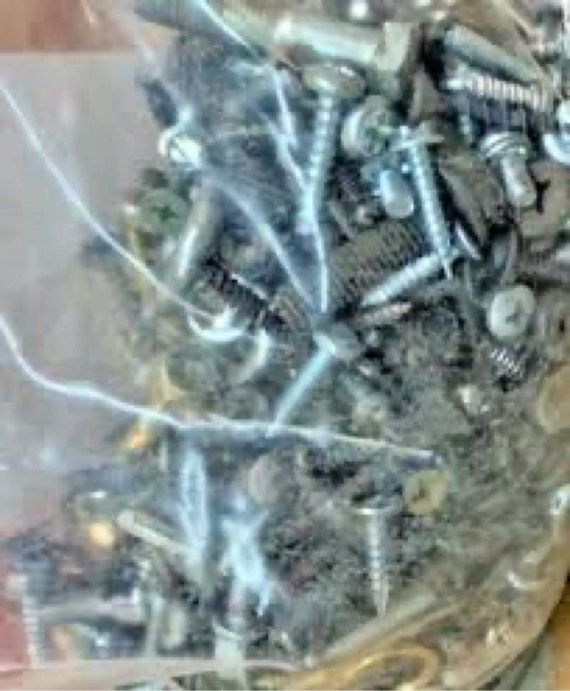 Mixture of small miscellaneous loose tools, screws, latches, home repair accessories