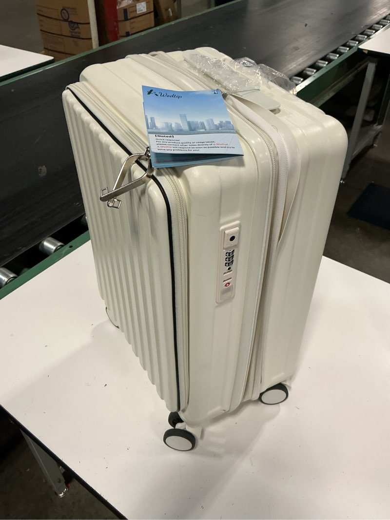 Condition photo showing Good Condition for white hard-shell suitcase features a vertical ribbed design and a top-opening front compartment for quick access carry-on