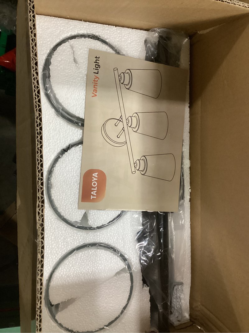 Condition photo showing New/Like New for TALOYA 19 Inch Brushed Black Bathroom Light Fixtures with Thickend Clear Tapered Glass Shade, 3-Light Modern Vanity Light Over Mirror for Bathrooms, Bedrooms (Bulbs Not Included) Black 3 Light