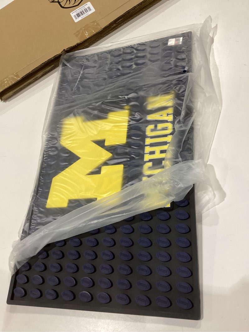 Condition photo showing Good Condition for The Memory Company Officially Licensed Team Logo Bar Mat, Non-Slip Rubber Heavy-Duty, for Countertop & Home Bar, Large, 19” x 11” University of Michigan