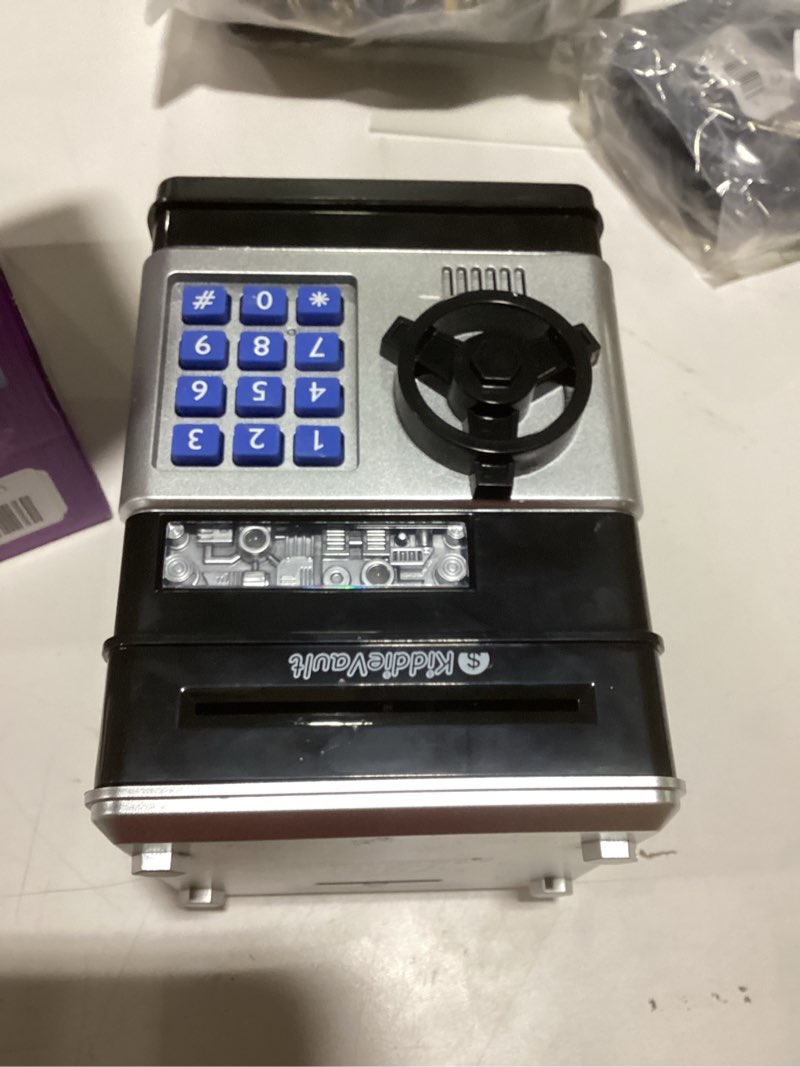 Condition photo showing Good Condition for Piggy Bank for Kids - Electronic Money Saving Box w/Code- ATM Safe - Toy Coin Bank - Easter Boys Toys for Age 3, 4, 5, 6, 7, 8, 9 - Birthday Gifts for 8, 9, 10, 11, 12 Year Old Boy and Girl Black & Silver