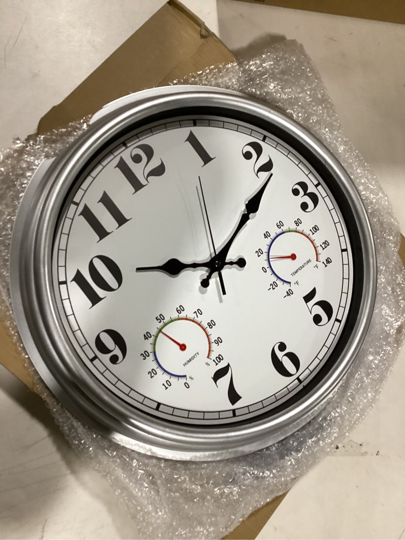 Condition photo showing New/Like New for JENLYSTIME 16 Inch Silver Vintage Waterproof Indoor/Outdoor Wall Clock with Thermometer & Hygrometer, Large Numerals & Silent Sweep Movement - Ideal for Porch, Garden, Pool 16''ht Silver