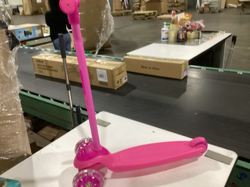 Condition photo showing As Is for 3 wheel scooter for kids, smooth light up led front wheels, wide anti slip deck, rear foot brake, easy lean to steer maneuvering, indoor & outdoor ride on toys for ages 2 up, pink