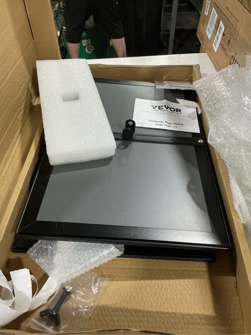 Condition photo showing As Is for vevor pedestal sign holder, 11 x 17 inch vertical and horizontal adjustable poster stand, heavy-duty floor standing sign holder with round base for display, advertisement, and outdoor, black 11 x 17 inch with round base