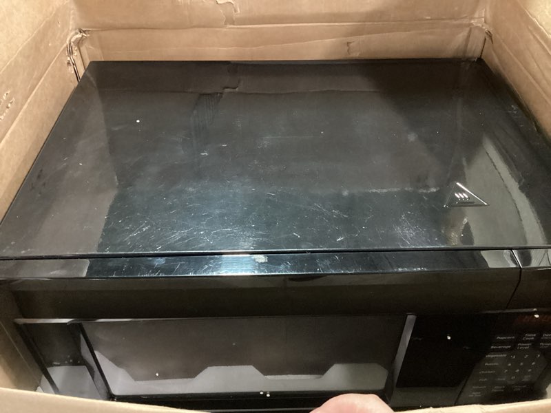 Condition photo showing As Is for GE GCST16S1WBB Microwave Oven, 1,150-watt 8 Auto Cooking Settings, Child-Lock Technology, Kitchen Essentials for The Countertop, Dorm Room or Apartment, 1.6 Cu. Ft, Black 1.6 Cu.Ft. Black