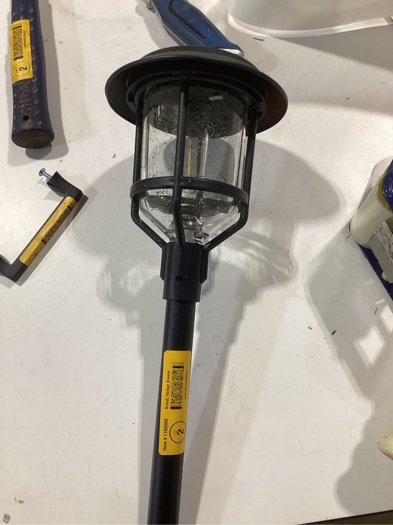 Condition photo showing As Is for harbor breeze 15 -lumens black solar led outdoor path light ( 3000-k ) incomplete