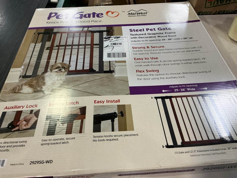 Condition photo showing New/Like New for midwest homes for pets 29-inch tall pet gate with textured graphite frame and decorative wood door, expands to 38 inches wide, includes 3-inch extensions decorative wood 29-inch