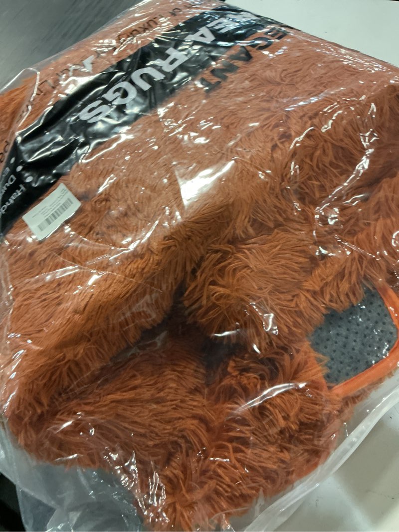 Condition photo showing As Is for amdrebio burnt orange area rugs for living room bedroom, 6x9 shaggy furry fuzzy fluffy rug for kids room decor aesthetic, large cute plush shag dark orange carpet for nursery dorm classroom playroom 6' x 9' (rectangular) burnt orange