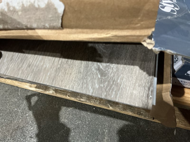 Condition photo showing As Is for procore plus dove tail oak 7-in wide x 5-mm thick waterproof interlocking luxury vinyl plank flooring (23.21-sq ft)
