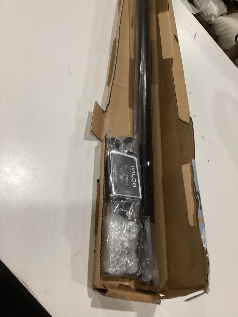 Condition photo showing As Is for ivilon curtain rod for windows 48 to 86 inch – 1 inch telescoping drapery rod, 2 long sections, end cap finials, black 48 to 86 in.