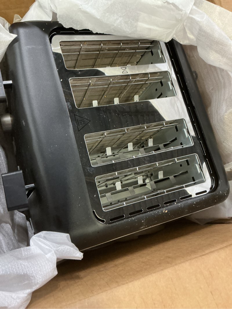 Condition photo showing As Is for amazon basics 4 slice toaster, with 7 browning settings, extra wide slots for bagels and special breads, removable easy-to-clean crumb trays, cancel/defrost/bagel buttons, 1500w, black & silver 4 slice matte black front