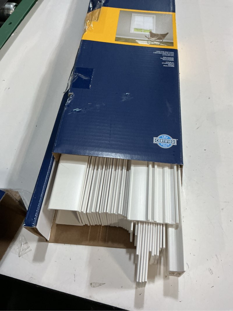 Condition photo showing As Is for levolor trim+go 2-in slat width 39-in x 64-in cordless white faux wood room darkening horizontal blinds