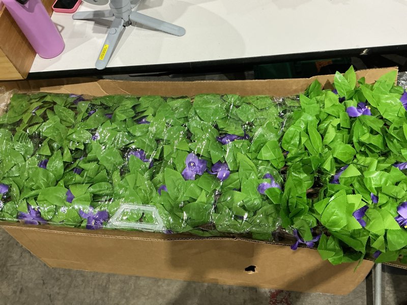 Condition photo showing Good Condition for doeworks expandable faux ivy trellis fence, patio privacy screen, 2 pack | lifelike artificial foliage creates a lush backdrop for weddings, parties, event decor,vertical gardens, and outdoor displays purple flowers 16 x 45 in, 2 panel