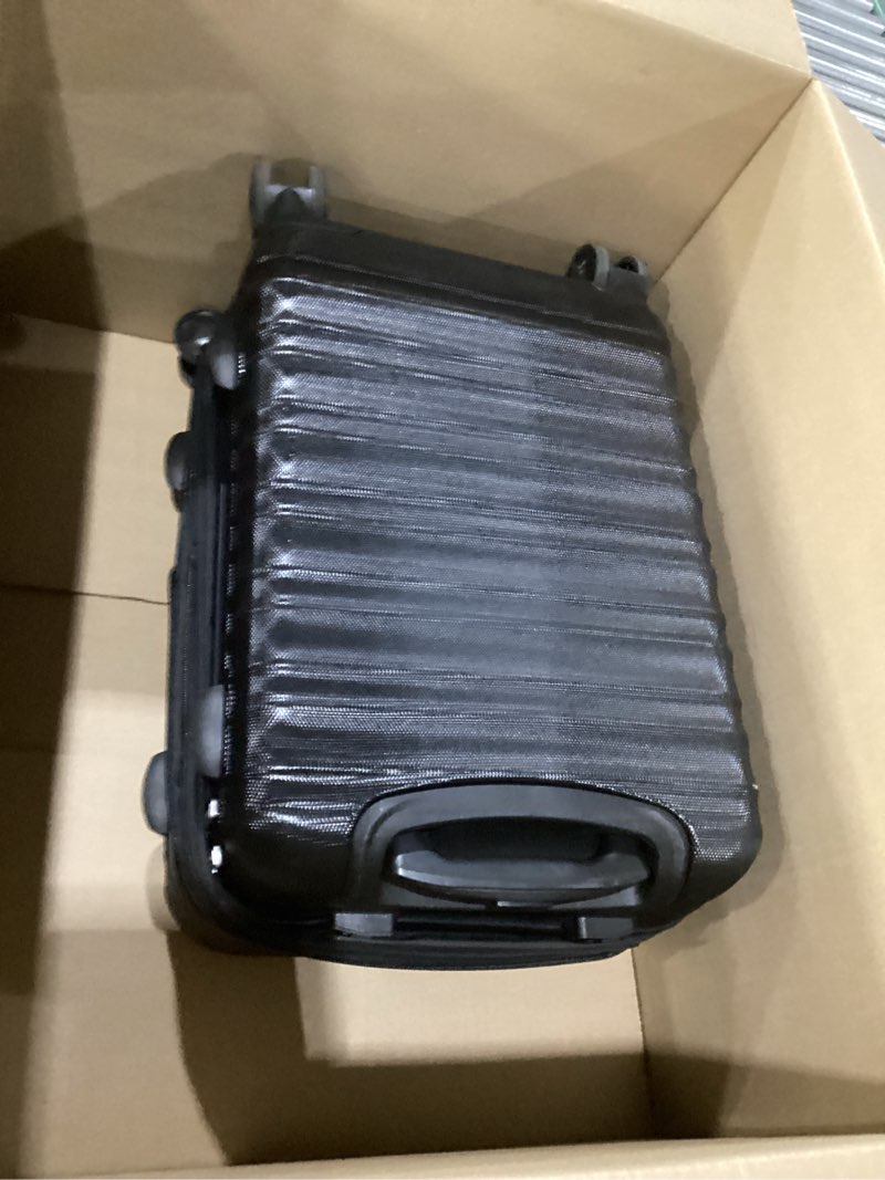 Condition photo showing New/Like New for amazon basics 21" hardside carry-on luggage with spinner wheels, expandable for up to 25% more space, scratch-resistant hard shell, telescoping handle, black black carry-on