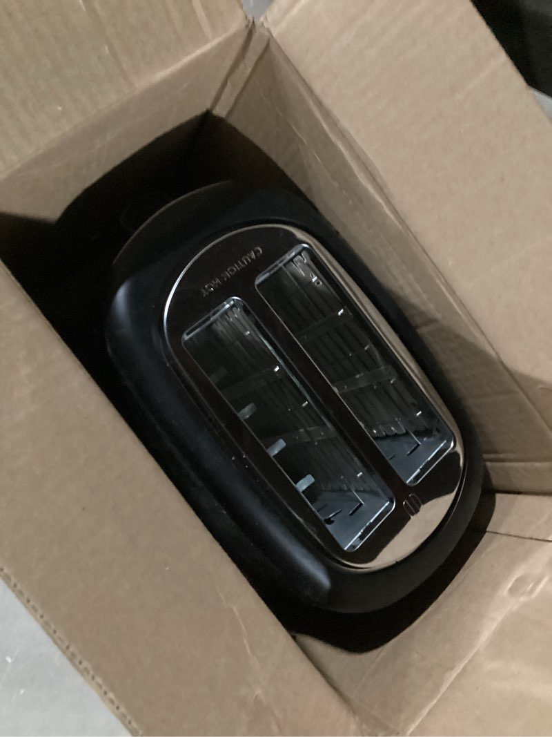 Condition photo showing As Is for Amazon Basics 2 Slice Toaster, With 6 Browning Settings, Extra Wide Slots For Bagels and Special Breads, Removable Easy-to-Clean Crumb Tray, Cancel/Defrost/Bagel Buttons, 900W, Black & Silver 2 Slice Silver Front