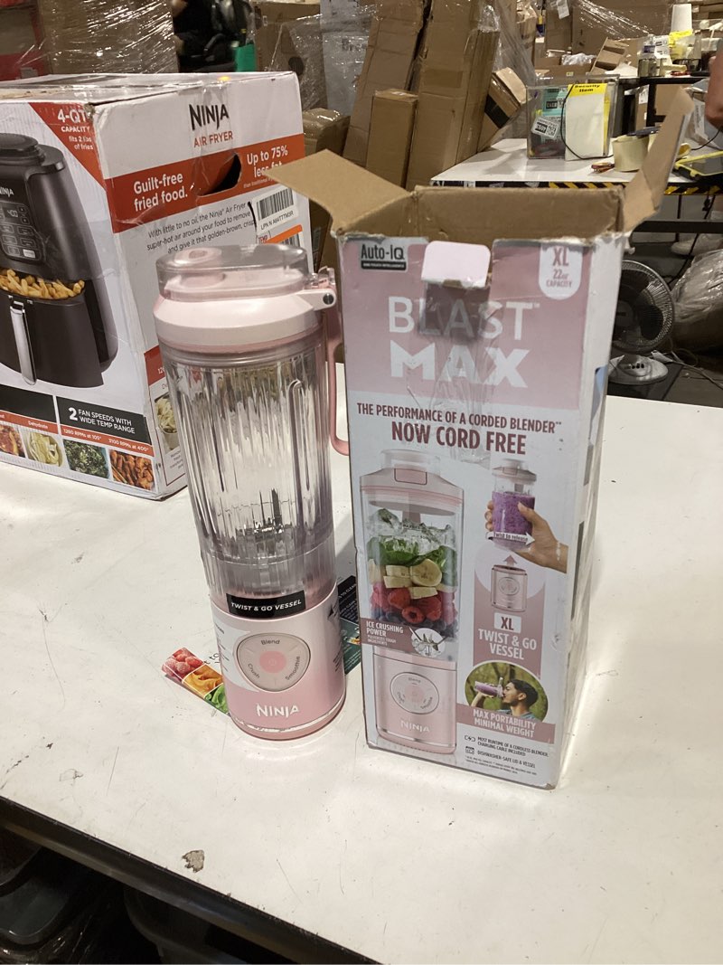 Condition photo showing As Is for ninja blast max, portable blender + twist & go, personal smoothie, blend, ice crush, 3 programs, cordless, 22 oz removable vessel, dishwasher safe, leakproof, pink, bc251pk pink 22 oz.
