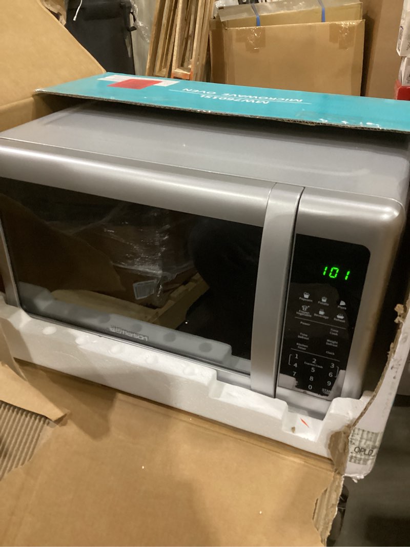 Condition photo showing As Is for Emerson MW7601SL Countertop Microwave Oven with Sleek Mirrored Finish Glass Door, 700W, 10 Power Levels and 6 Pre-Programmed Settings with Child Safe Lock, 0.7. Cu. Ft., Silver 0.7 Cu. Ft.(powers on)