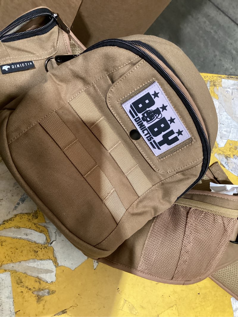 Condition photo showing As Is for dinictis baby hip carrier for baby & toddler (up to 45 lbs), coyote brown | ergonomic m-shaped seat, military style, adjustable wide waistband, molle webbing, utility pockets