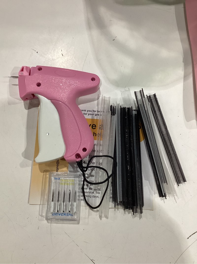 Condition photo showing New/Like New for stitch gun for clothes - handheld stitch gun quick clothing fixer - tagging gun - includes 6 needle, 1000 black fasteners & 1000 white fasteners pink-white