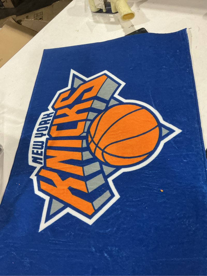 Condition photo showing As Is for FANMATS 11918 New York Knicks Starter Mat Accent Rug - 19in. x 30in. | Sports Fan Home Decor Rug and Tailgating Mat