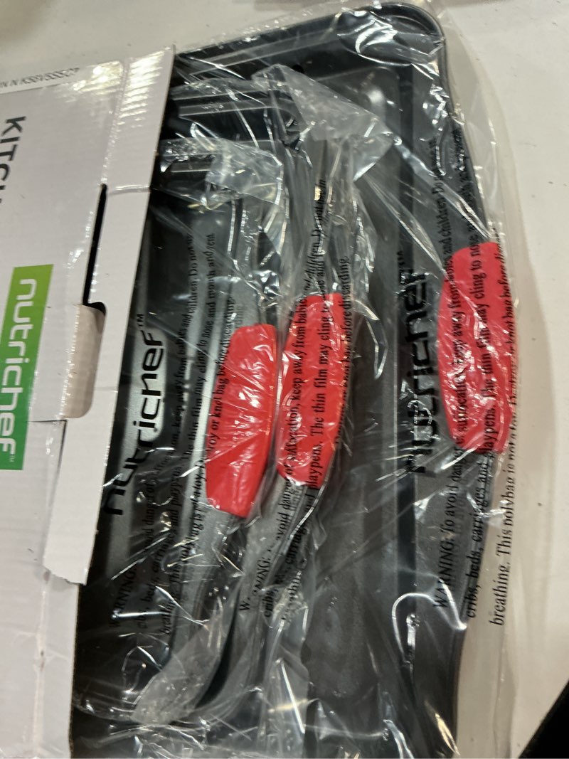 Condition photo showing New/Like New for nutrichef 3-piece nonstick kitchen oven baking pans - premium & stylish non-stick steel, commercial grade restaurant quality metal bakeware with red silicone handles - easy to clean, ncsbs3s