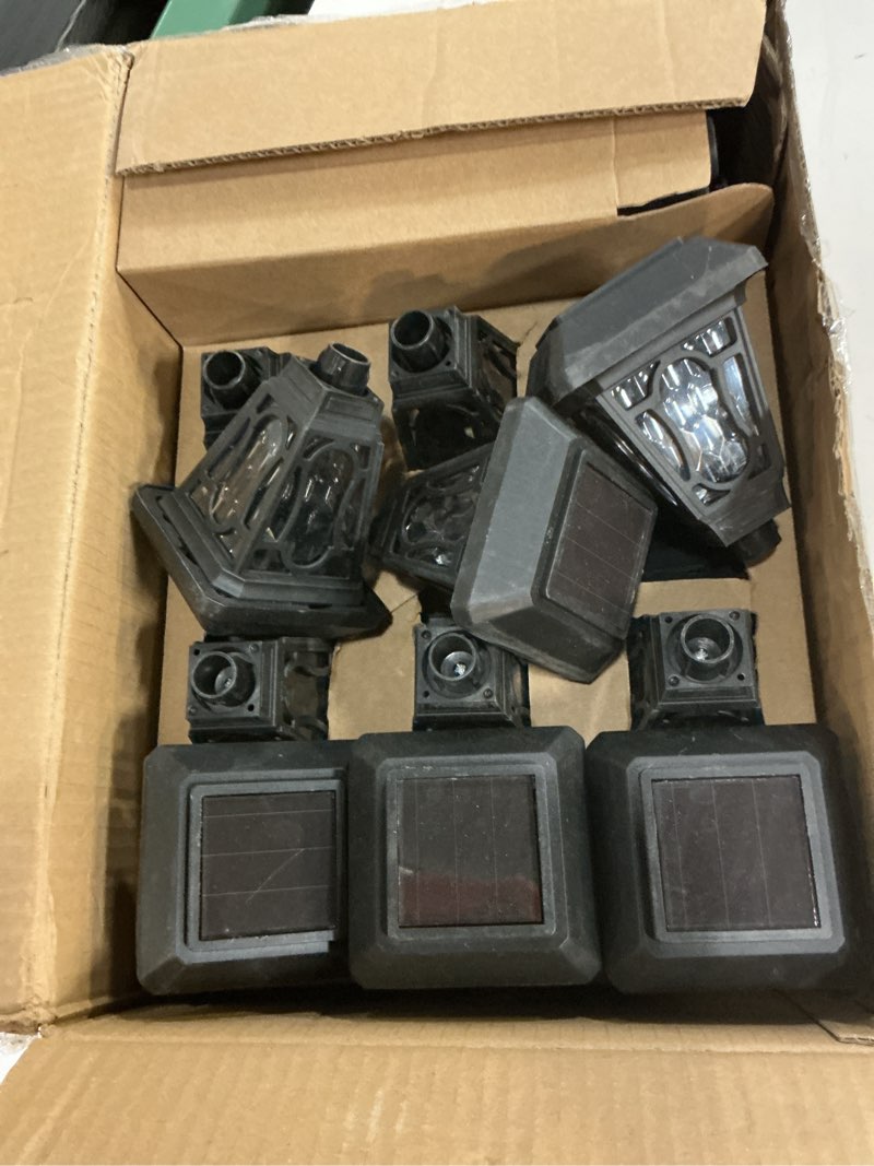 Condition photo showing As Is for 12 pack solar lights with cute light patten, 3 lumens cool white led, for pathway,path, patio, yard, driveway, walkway, lawn and garden