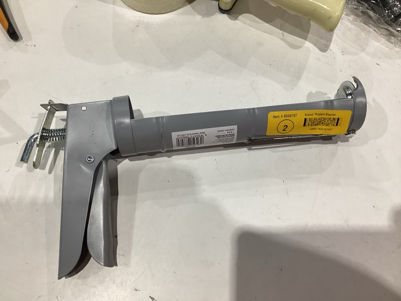 Condition photo showing As Is for project source 10 -oz smooth rod caulk gun
