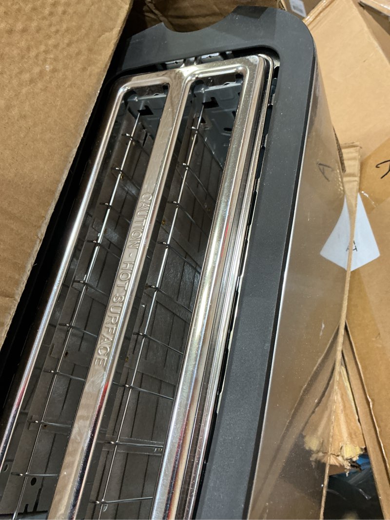 Condition photo showing As Is for elite gourmet ect-3100 4-slice long slot toaster | extra wide slots for bagels, sourdough & texas toast | 6 browning settings | reheat, defrost & cancel | built-in warming rack | stainless steel 4 slice black/stainless steel