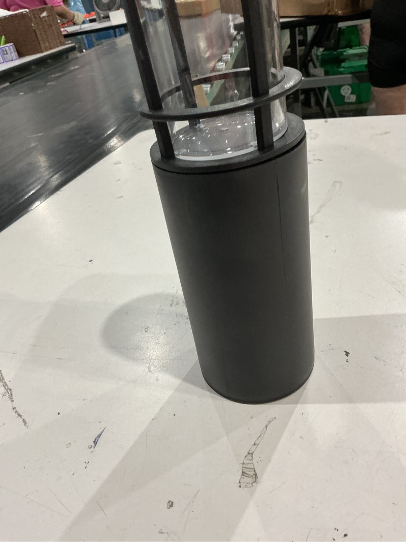 Condition photo showing As Is for (incomplete, missing pieces)harbor breeze 10 -lumens black solar led outdoor path light with dusk-to-dawn sensor