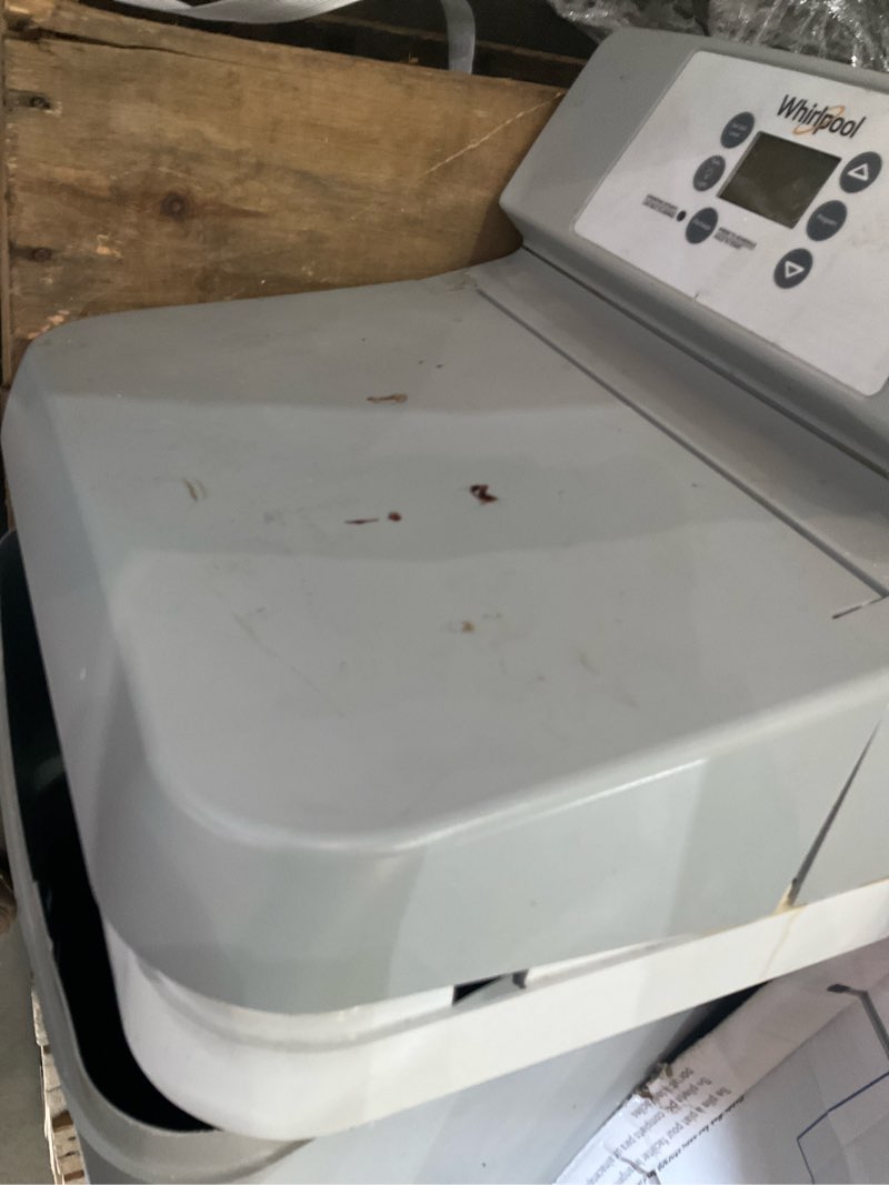 Condition photo showing As Is for water softener
